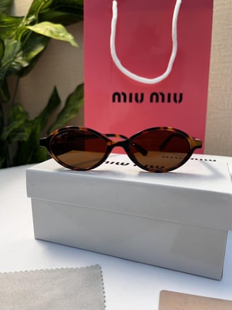 نظارة - MIU MIU اطار تايقر- عدسة بني