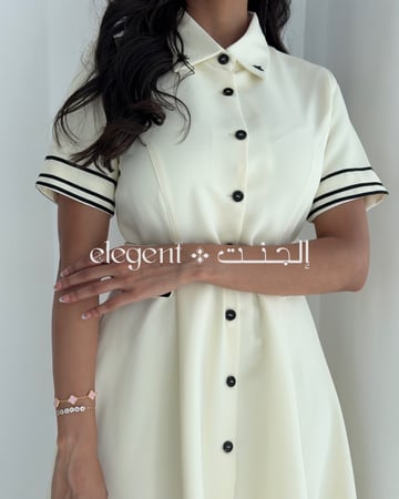 تفاصيل الأزرار الأمامية لفستان ناعم