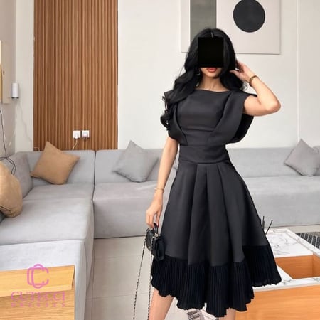 فستان سهرة أسود ميدي بكم مميز وتنورة بكسرات ميكادو أنيقة