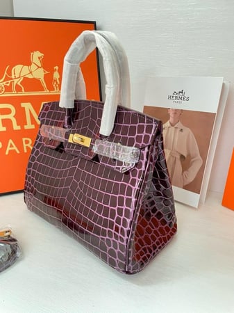 حقيبة هرمز جلد لامع