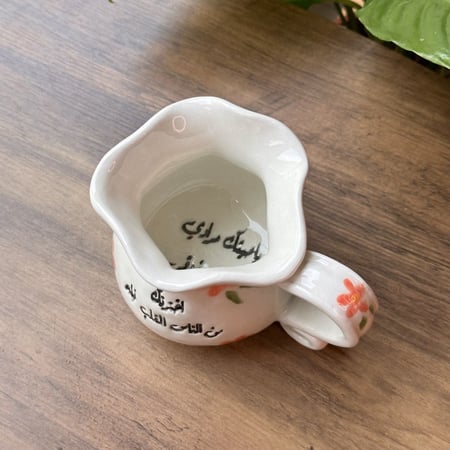 كوب الورود بعبارة