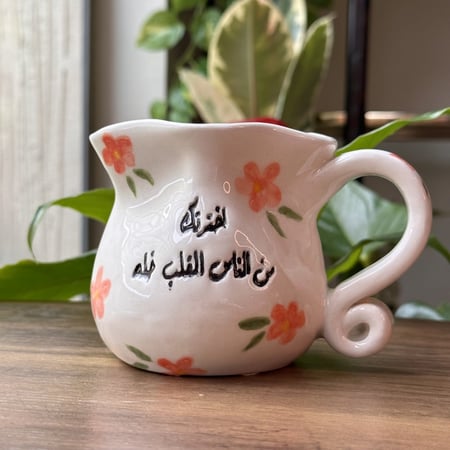 كوب الورود بعبارة