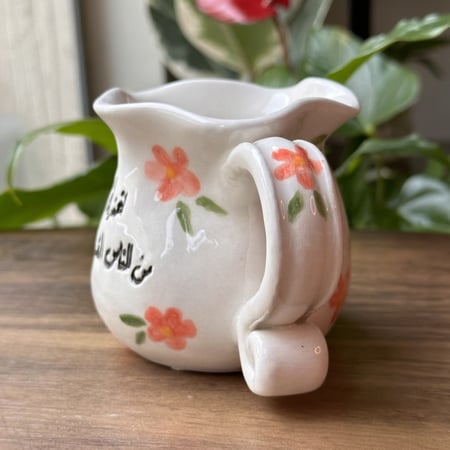 كوب الورود بعبارة