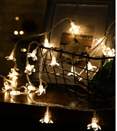 ضوء بشريط لمبات على شكل ورد يعمل بالبطاريه