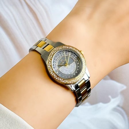 ساعة نسائية استيل بلون الفضي و الذهبي اطار ذهبي ميناء رمادي