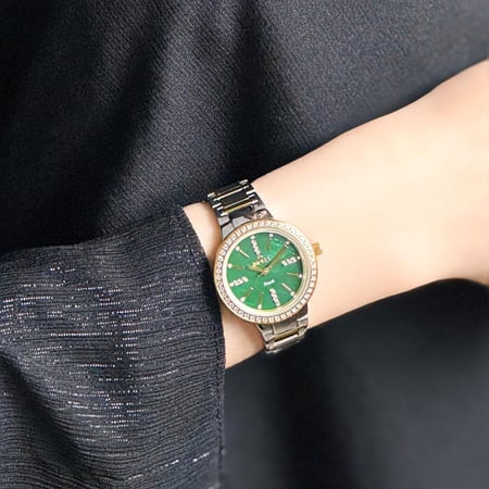 ساعة نسائية استيل بلون فضي وذهبي اطار ذهبي ميناء اخضر