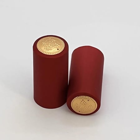 بلاستيك حراري (PVC) احمر (عنابي ) لقفل علب الزجاج " شرنك"(100 حبه) بدون شريط فتح