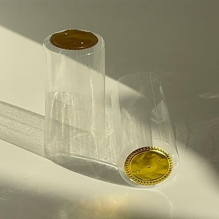 بلاستيك حراري (PVC) شفاف لقفل علب الزجاج " شرنك"(100 حبه) بدون شريط فتح