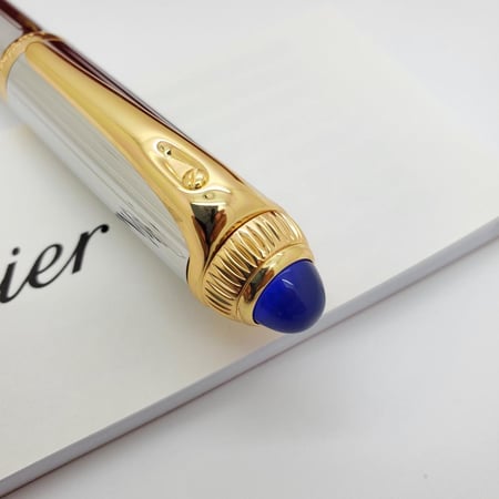 قلم كارتير رودستر فضي بذهبي فص ازرق