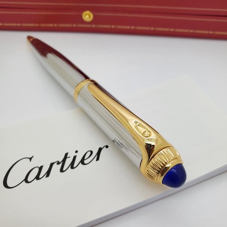 قلم كارتير رودستر فضي بذهبي فص ازرق