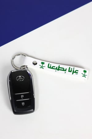 مجموعه(12) ميدلية مع عبارة عزنا بطبعنا