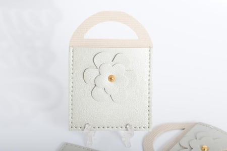 مجموعه (12) جيوب جلد  مع ورده بيد لون رصاصي