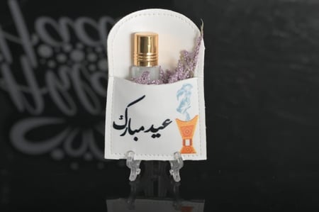 مجموعه (12) جيوب جلد بي عبارة عيد مبارك مع ربع تولة او اختار