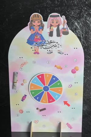 عجلة الحظ  بي عبارة (عيد سعيد) كرتوني مقاس30*50سم