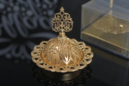 مجموعه (12) راس مبخرة لون ذهبي بي علبة شفاف