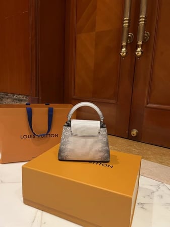 LV capucines lizard skin