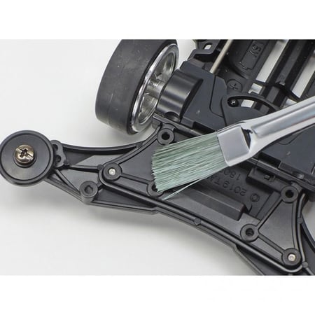 واضع الملصقات مع فرشاة التنظيف