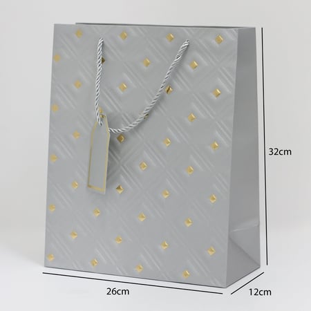 أكياس هدايا مزخرفة بنقاط ذهبية