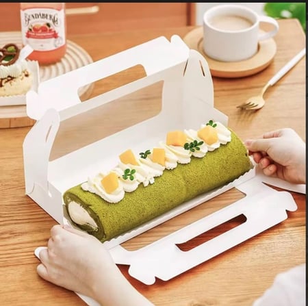 علب كيك وحلويات ورقيه بمسكة