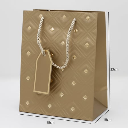 أكياس هدايا مزخرفة بنقاط ذهبية