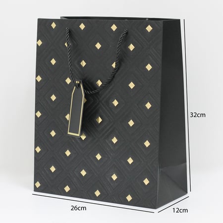 أكياس هدايا مزخرفة بنقاط ذهبية