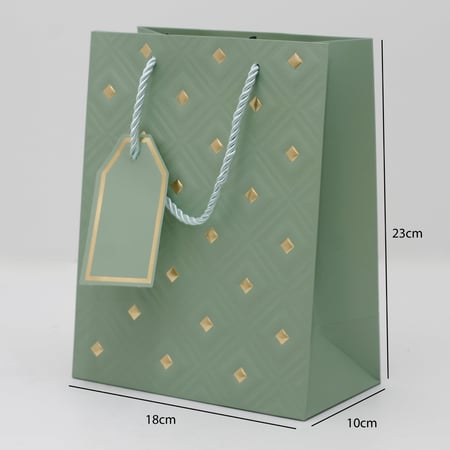 أكياس هدايا مزخرفة بنقاط ذهبية