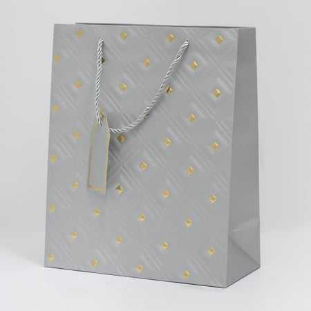 أكياس هدايا مزخرفة بنقاط ذهبية