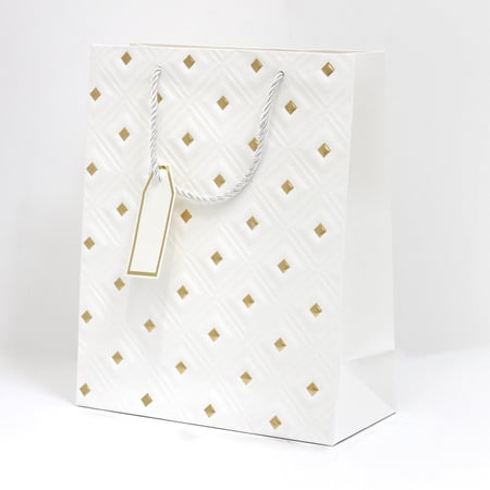 أكياس هدايا مزخرفة بنقاط ذهبية