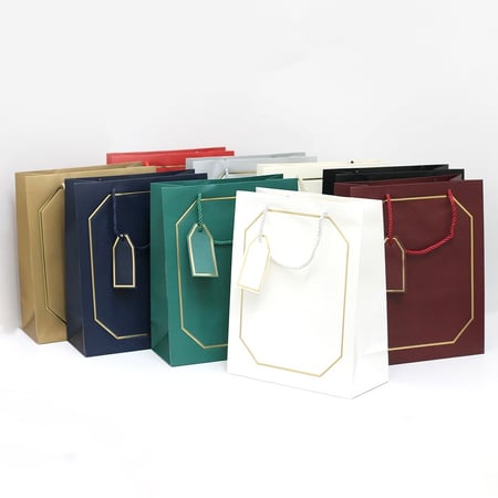 أكياس هدايا بإطار ذهبي