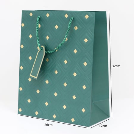 أكياس هدايا مزخرفة بنقاط ذهبية