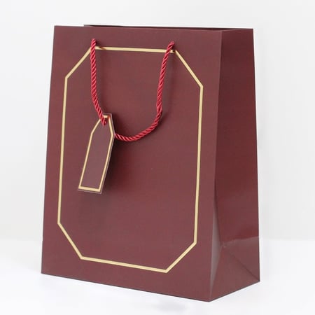 أكياس هدايا بإطار ذهبي