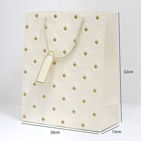 أكياس هدايا مزخرفة بنقاط ذهبية