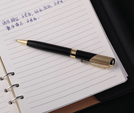 قلم للجنسين بالحبر الجاف مزين بأطراف ذهبية