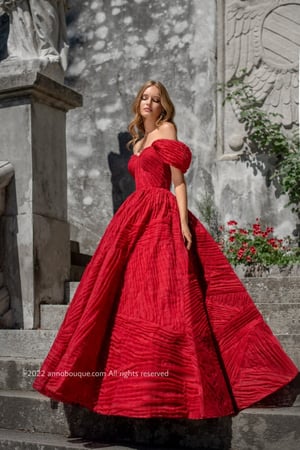 ‏  Off-shoulder gown with Puffy skirt