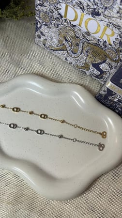 إسوارة Christian Dior فضي - ذهبي