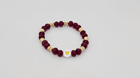 إسورة خرز زجاجي بلون عودي مع فواصل ذهبيه فاخره