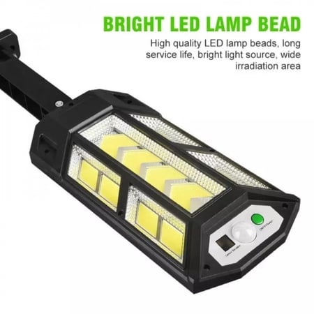 عرض كشاف طاقة شمسية وسط مع هدية جدارية تعمل بالطاقة الشمسية