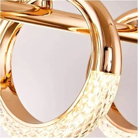 ثريا طاولة طعام فاخرة بإضاءة LED داخل حلقات ذهبية معلقة