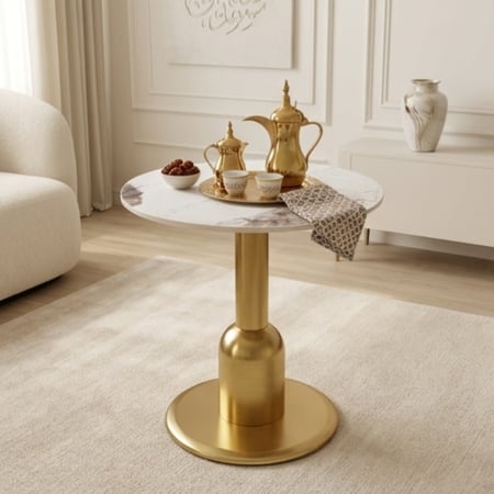 طاولة كافيه دائرية بسطح سيراميك وقاعدة ذهبية تصميم مودرن فاخر