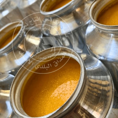 طريقة تحضير سمن القاضي التقليدية باستخدام أواني معدنية -متجر القاضي