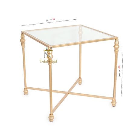 طاولة جانبية لون ذهبي قواعد حديد سطح زجاج شفاف