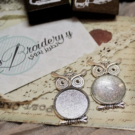 قلائد فضية شكل بومه