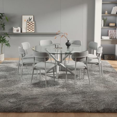 طاولة طعام زجاجية بقاعدة معدنية لون رصاصي