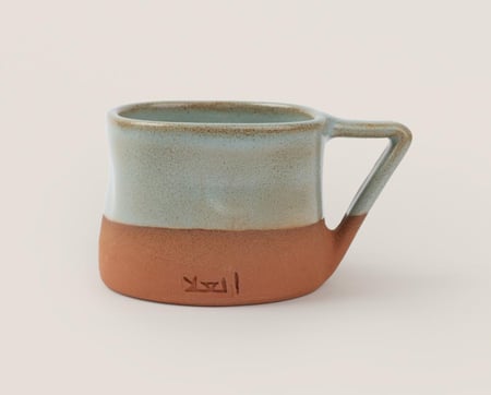 كوب دادان بممسك