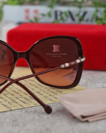 نظارة شمسية نسائية ماركة كارولينا هيريرا - Burgundy Buterfly