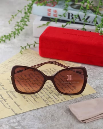 نظارة شمسية نسائية ماركة كارولينا هيريرا - Burgundy Buterfly