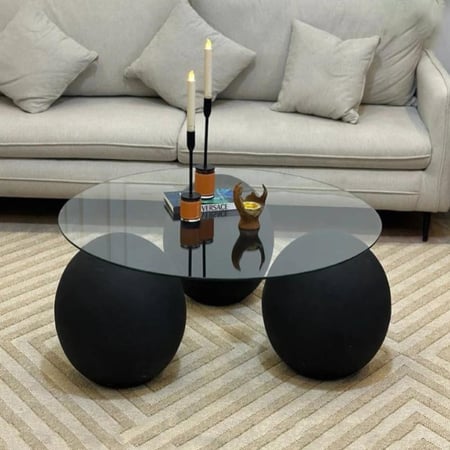 طاولة ضيافة زجاج بقواعد دائرية رخام بلون أسود