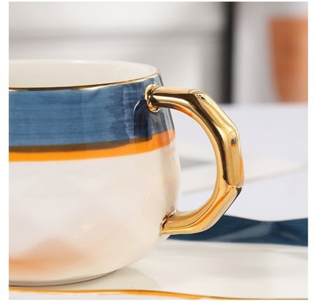 كوب قهوة سيراميك بتصميم مميز مع طبق تقديم وملعقة