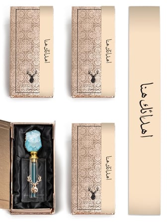 علب توزيعات ذهبية فيها مسك حجم كبير بحجر كريم من متجر توزيعات الغزال