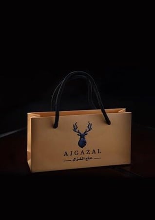 حقيبة توزيعات بنيه من متجر عاج الغزال